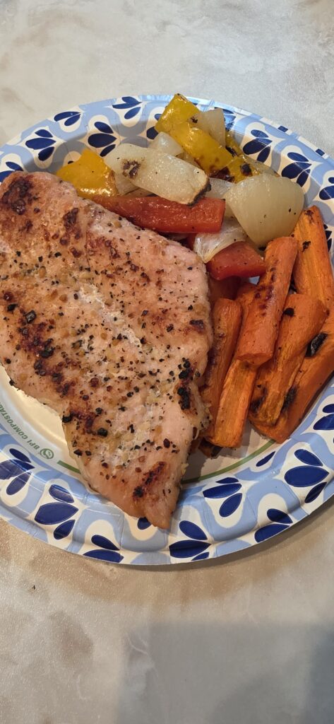 Roasted chicken breast with carrots, onions and bell peppers cooked while traveling with dietary restrictions.